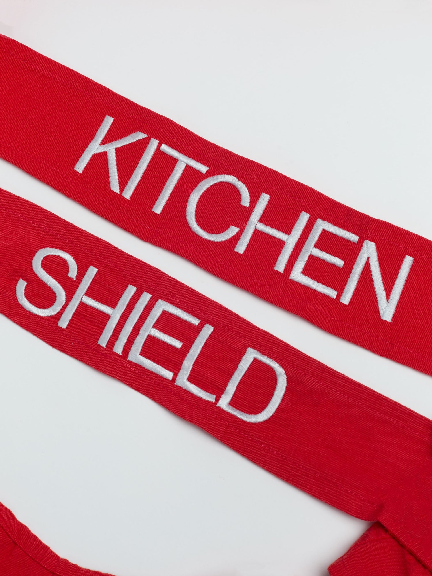 Fondo. All rights reserved. Kitchen Shield Apron